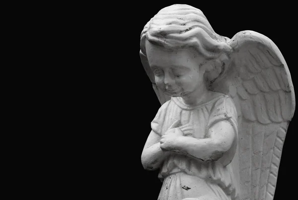 彼の膝の上の祈り小さな天使の像 — ストック写真