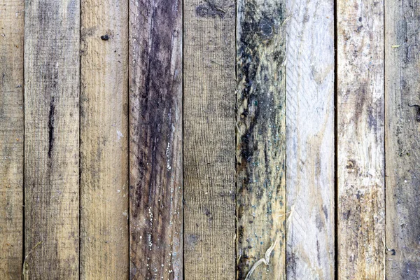 A moldy wooden wall in poor condition