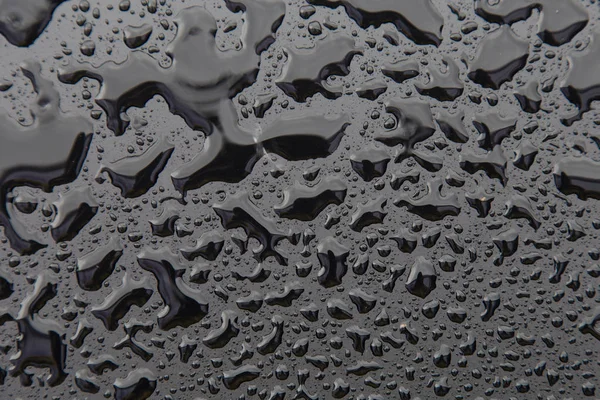 Kapky vody na černou texturou. Walpaper — Stock fotografie