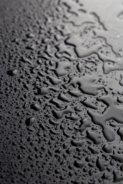 Drops of water on black texture. Walpaper — Stock Photo, Image
