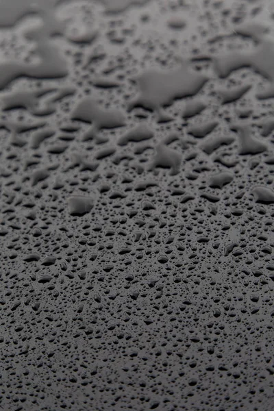 Drops of water on black texture. Walpaper — Stock Photo, Image