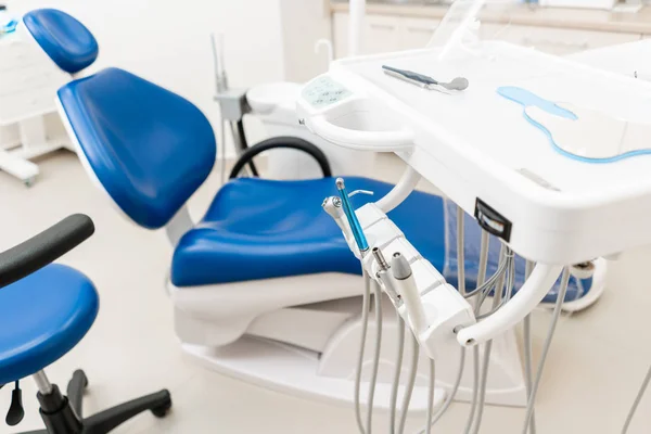 Close-up dental high speed turbine. Dental work in clinic. Operation, tooth replacement. Medicine, health, stomatology concept. Office where dentist conducts inspection and concludes.