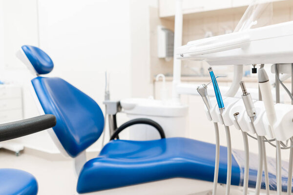 Close-up dental high speed turbine. Dental work in clinic. Operation, tooth replacement. Medicine, health, stomatology concept. Office where dentist conducts inspection and concludes.