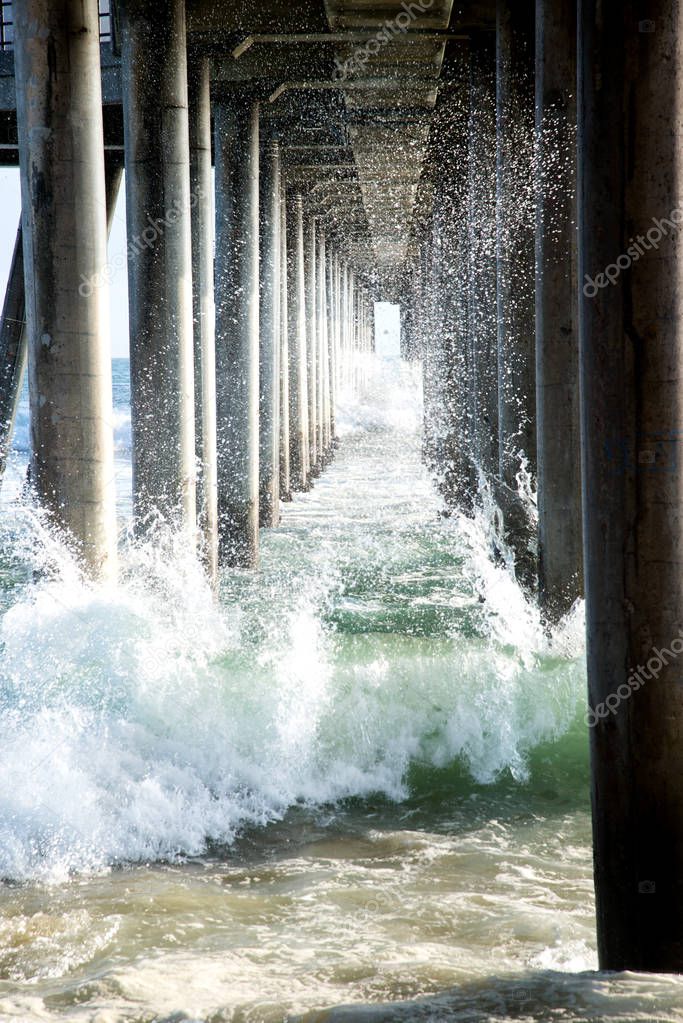 The crashing surf under the Huntington Beach pier.
