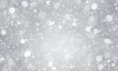 Gri gradyan arkaplan üzerindeki bulanık sim parçacığı veya bokeh.