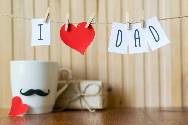 Fathers day greeting. Message with paper heart hanging with clothespins over wooden board. Happy Birthday — Stock Photo, Image