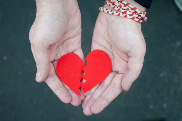 Divorce concept - Broken heart in the male hands. — Stock Photo, Image