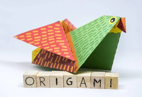 Paper origami bird isolated on a white background — Stock Photo, Image