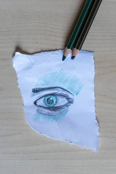 Ögat ritat på ett pappersark med färgade pennor — Stockfoto