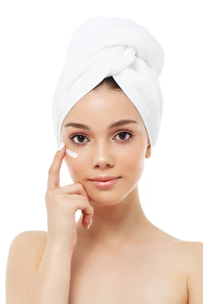 Beautiful woman in a white towel on a head with cream — Stock Photo, Image