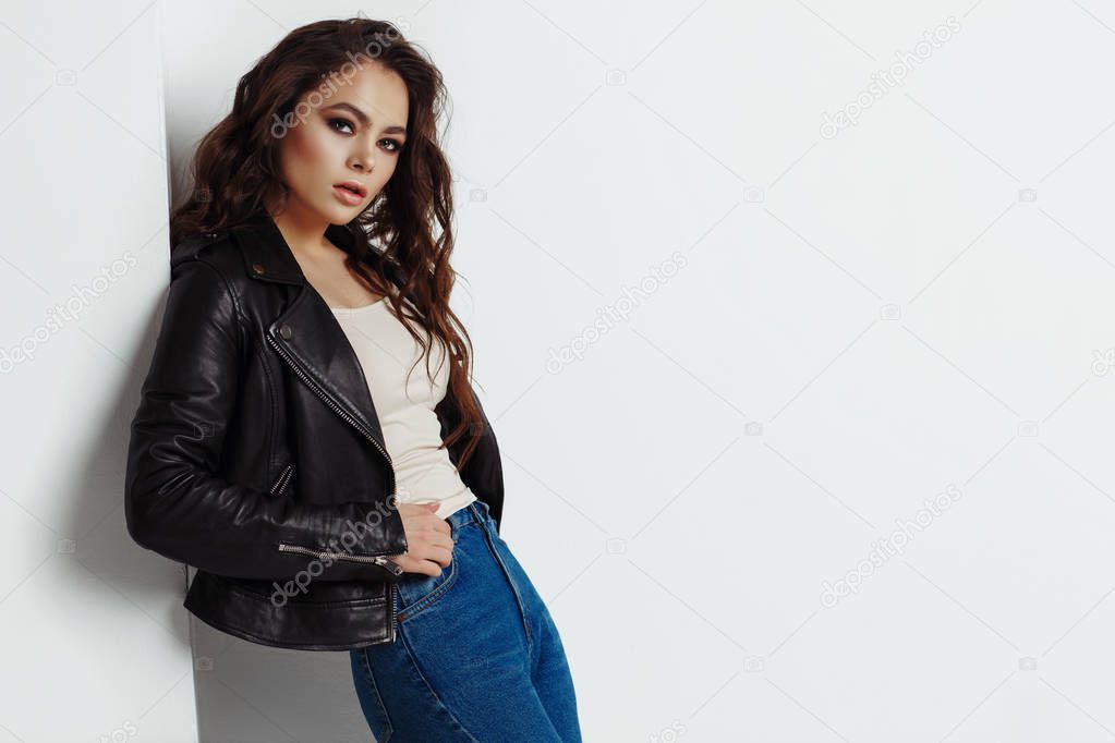 Young beautiful woman in a black jacket