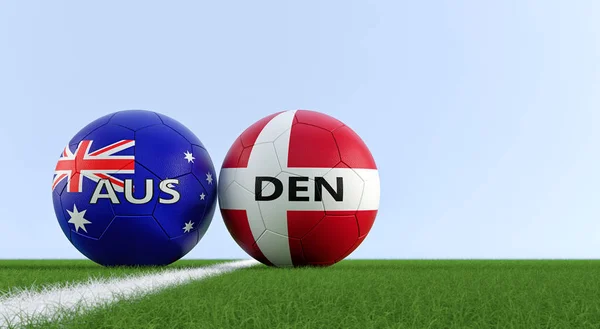 Denmark vs. Australia Soccer Match - Soccer balls in Australia and Denmarks national colors on a soccer field. Copy space on the right side - 3D Rendering