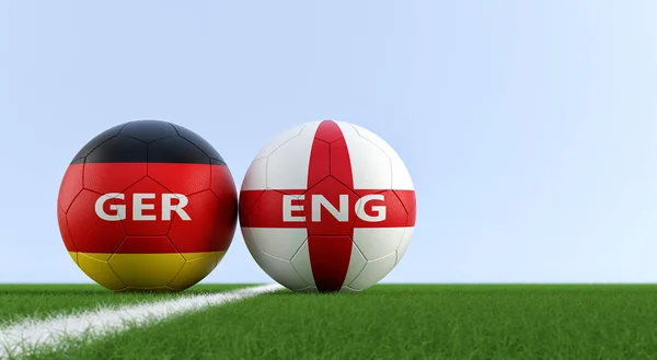 Germany vs. England Soccer Match - Soccer balls in Germanys and Englands national colors on a soccer field. Copy space on the right side - 3D Rendering