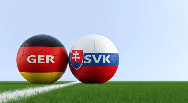 Slovakia vs. Germany Soccer Match - Soccer balls in Slovakia and Germany national colors on a soccer field. Copy space on the right side - 3D Rendering