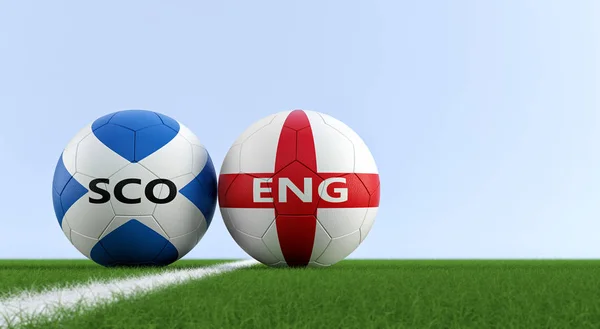 Scotland vs. England Soccer Match - Soccer balls in Scotland and England national colors on a soccer field. Copy space on the right side - 3D Rendering