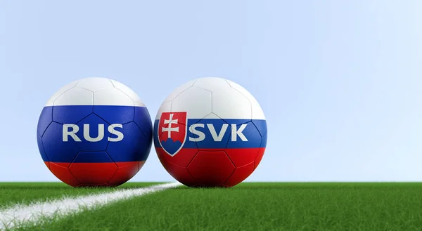 Russia vs. Slovakia Soccer Match - Soccer balls in Russia and Slovakia national colors on a soccer field. Copy space on the right side - 3D Rendering