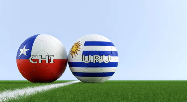 Uruguay vs. Chile Soccer Match - Soccer balls in Uruguay and Chile national colors on a soccer field. Copy space on the right side - 3D Rendering
