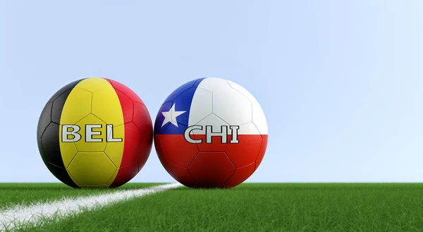 Belgium vs. Chile Soccer Match - Soccer balls in Belgium and Chile national colors on a soccer field. Copy space on the right side - 3D Rendering