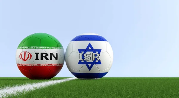 Israel vs. Iran Soccer Match - Soccer balls in Israel and Iran national colors on a soccer field. Copy space on the right side - 3D Rendering