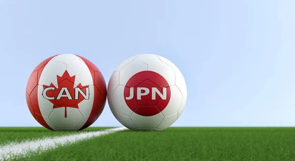 Japan vs. Canada Soccer Match - Soccer balls in Japan and Canada national colors on a soccer field. Copy space on the right side - 3D Rendering
