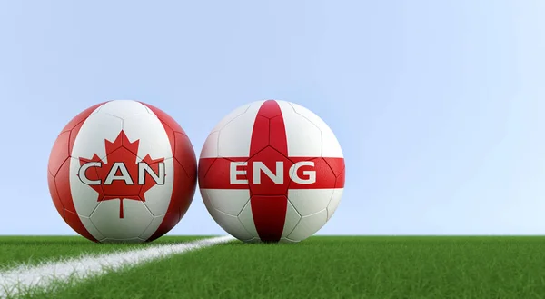 England vs. Canada Soccer Match - Soccer balls in England and Canada national colors on a soccer field. Copy space on the right side - 3D Rendering