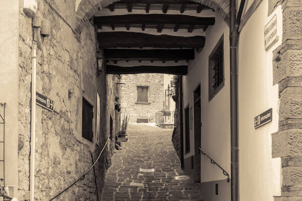 Black and white sepia picture from historic alley