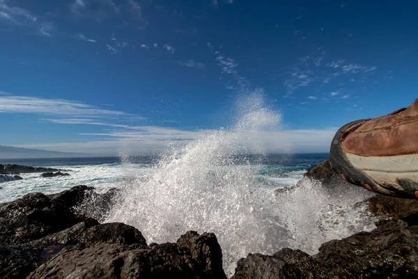 spectacular crashing waves over the rocks