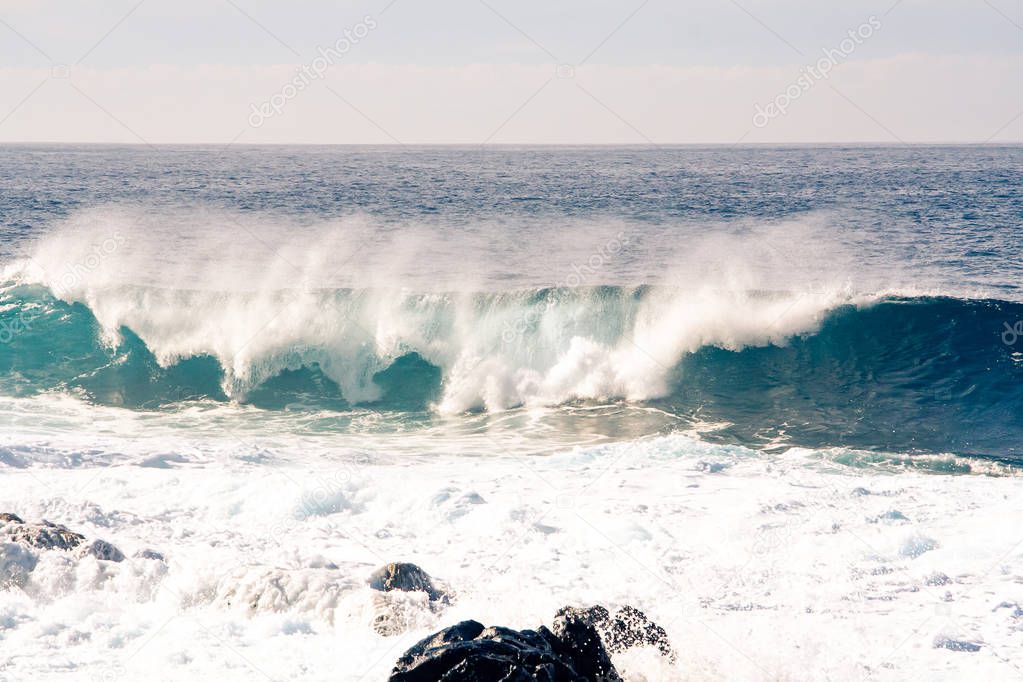Fantastic waves tube rolls over the coast