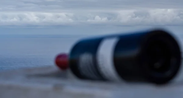 Art pic with a wine bottle and sea — Stock Photo, Image