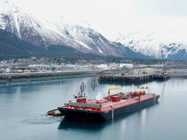 Tugboat and barge delivering fuel to Seward, Alaska