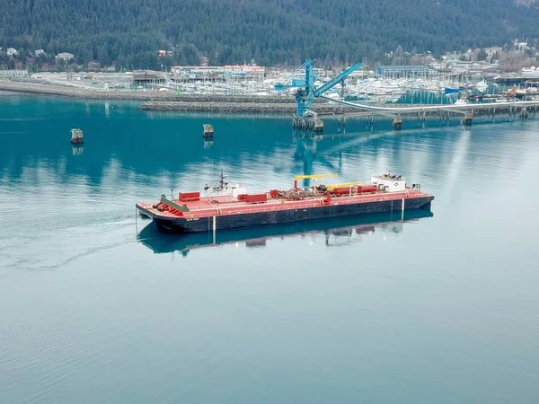 Tugboat and barge delivering fuel to Seward, Alaska