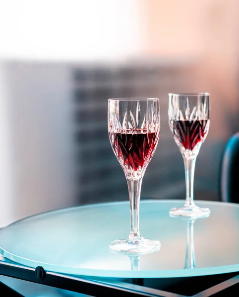 two glasses of red wine on table in restaurant