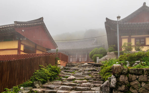 Entrance to Korean Buddhistic Temple Daeseongam, Great Saint Hermitage, near Beomeosa on a foggy day. Located in Geumjeong, Busan, South Korea, Asia.