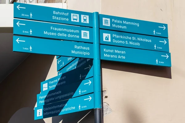 Bilingual Signpost in the main district of Meran guide tourists located in Laubengasse. Merano. Province Bolzano, South Tyrol, Italy. Europe.