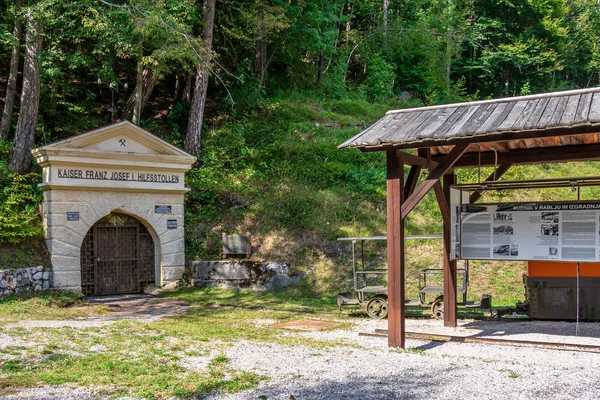 Ver onMining Tunnel Kaiser Franz Josef Hilfsstollen with Explanation Pavilion and Vehicle in Log pod Mangartom, Bovec, Slovenia, Europe . — Foto de Stock