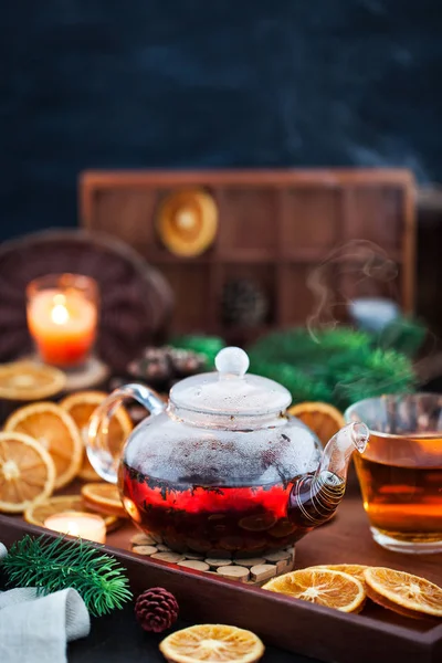 Glass Teapot Hot Black Tea Cozy Background Dried Oranges Candles — Stock Photo, Image