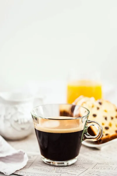 Continental breakfast table with cup of hot black coffee, milk, — Stock Photo, Image
