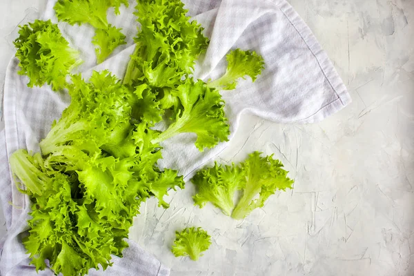 Fresh raw green frillice iceberg lettuce salad on table, top vie — Stock Photo, Image