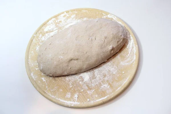 dough ball on a wooden board