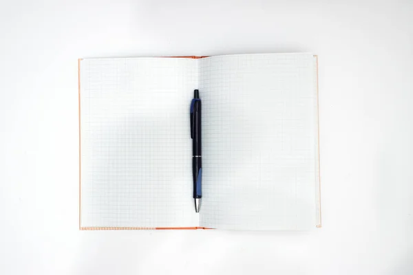 Pencil on the notebook on white background