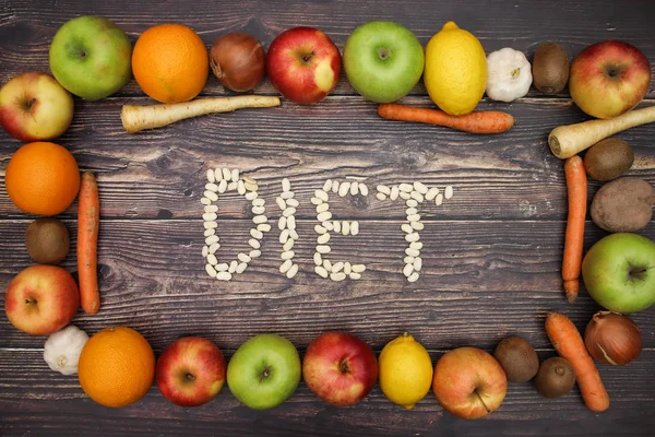 Diet word written with beans and fruits and vegetables around