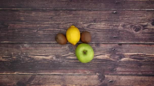 Fruits Appear Wooden Background Stop Motion — Stock Video