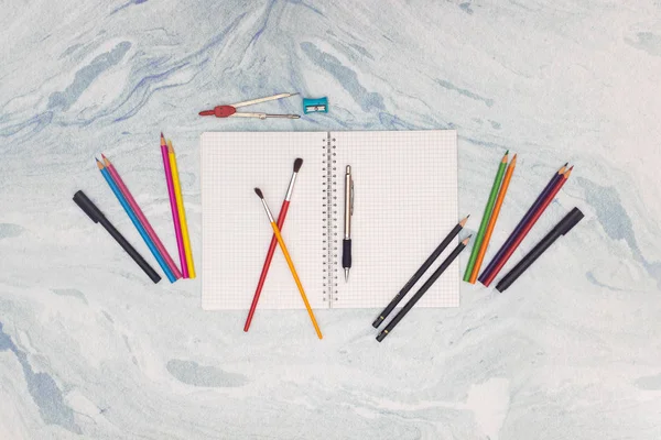 Back to school - School and art supplies on the background