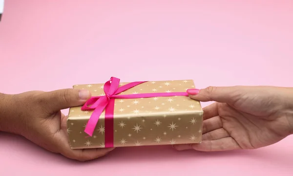 Man give gift to woman