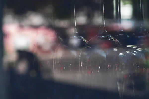 Close up of blurred vine glasses behind a window — Stock Photo, Image