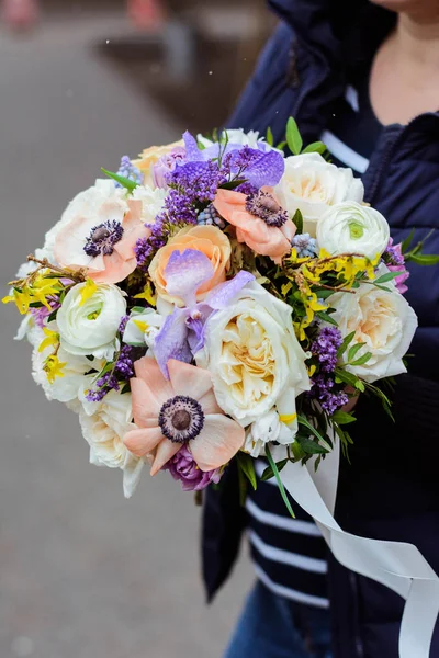bouquet of lilac, rose, Narcissus, hyacinth, Ranunculus, Tulip, Bush rose, chrysanthemum, eucalyptus, animon, peony in a floral shop