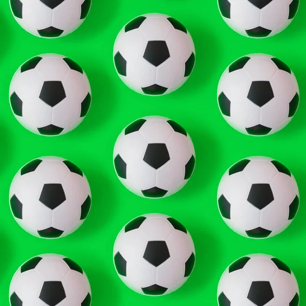 Many black and white soccer balls background. Football balls in a water — Stock Photo, Image