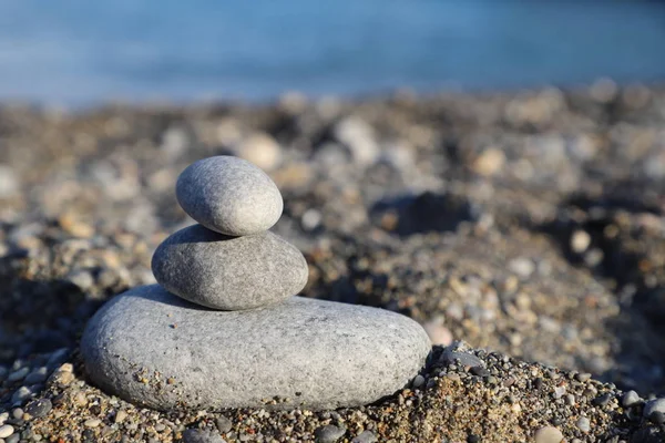 The balance of stones on the beach. Balance. Macro. Screensaver and background. Relax