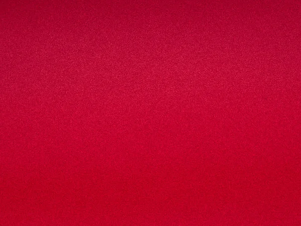 Grainy seamless background. Textured plain magenta color surface.