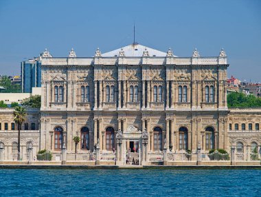 Dolmabahce palace exterior gate view from sea. Istanbul, Turkey. clipart